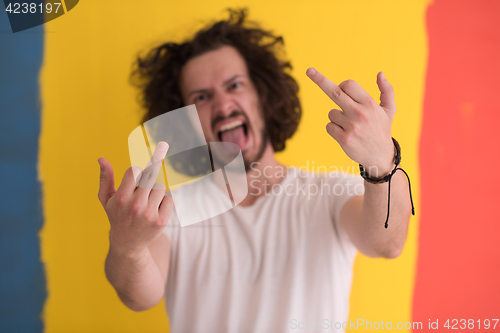 Image of young man with funny hair over color background