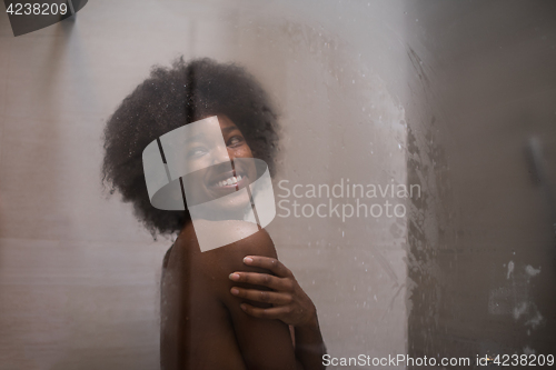 Image of African American woman in the shower