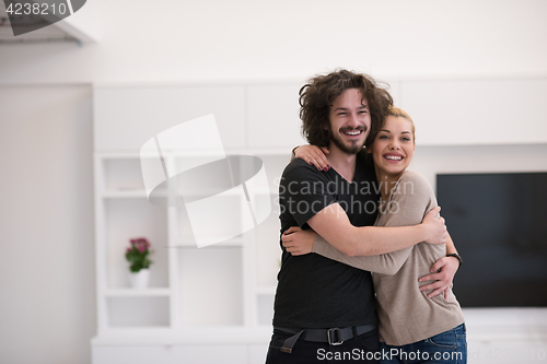 Image of couple hugging in their new home