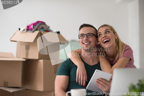 Image of Young couple moving in a new home