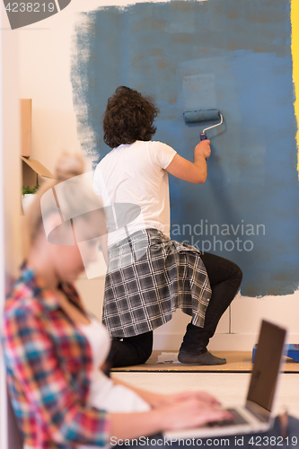 Image of Happy couple doing home renovations