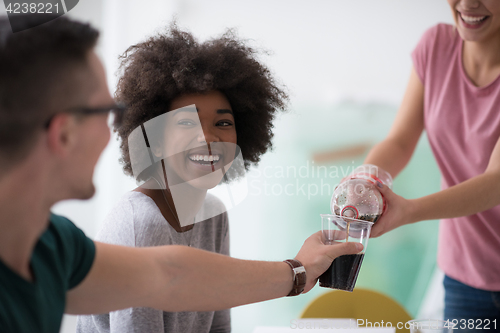 Image of multiethnic group of young people have a lunch break