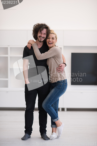 Image of couple hugging in their new home