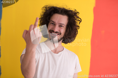 Image of young man with funny hair over color background