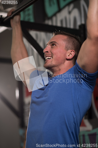 Image of man doing pull ups