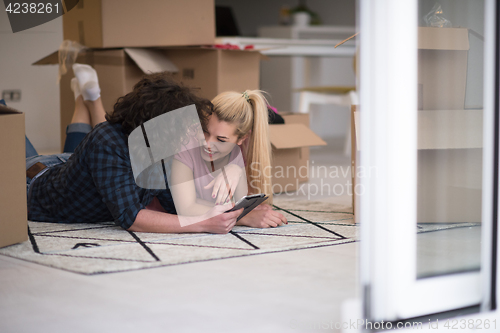 Image of Young couple moving in a new flat