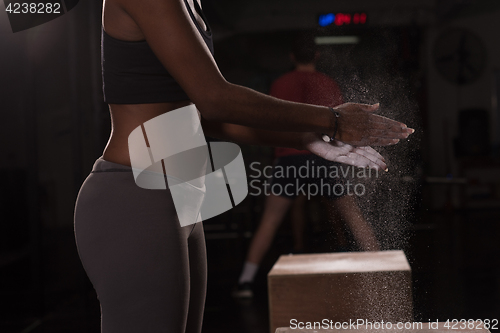 Image of black woman preparing for climbing workout
