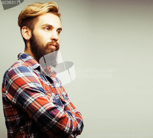 Image of portrait of young bearded hipster guy smiling on white backgroun