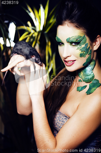 Image of woman with creative make up like snake and rat in her hands, hal