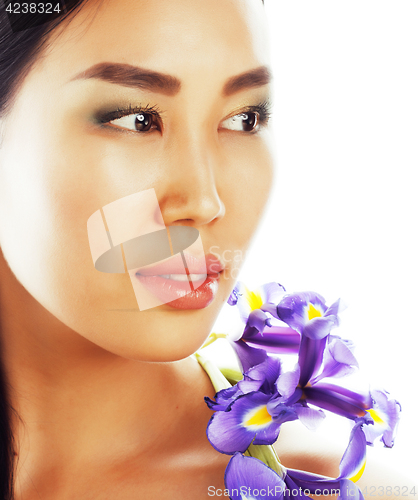 Image of young pretty asian woman with flower orchid close up isolated sp