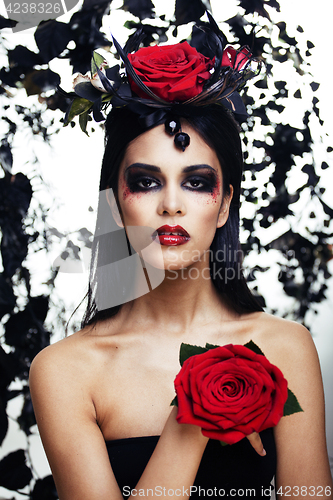 Image of pretty brunette woman with rose jewelry, black and red, bright m