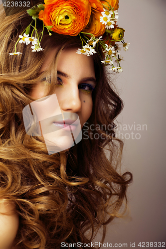 Image of Beauty young woman with flowers and make up close up, real sprin