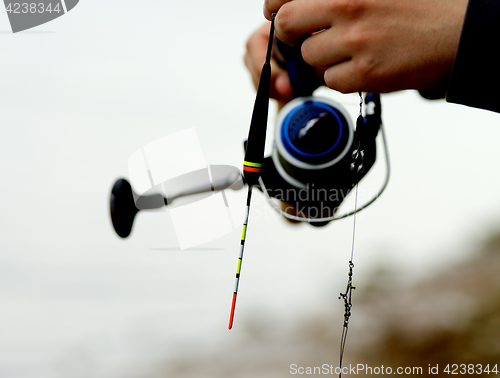 Image of Man Holding Fishing Rod