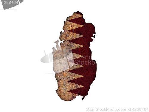 Image of Map and flag of Qatar on rusty metal