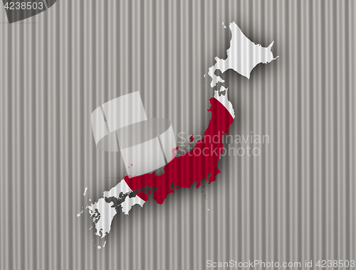 Image of Map and flag of Japan on corrugated iron