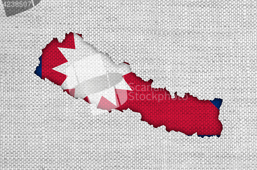 Image of Map and flag of Nepal on old linen