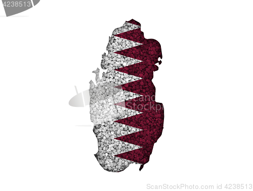 Image of Map and flag of Qatar on poppy seeds