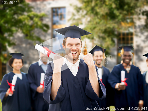 Image of happy student with diploma celebrating graduation