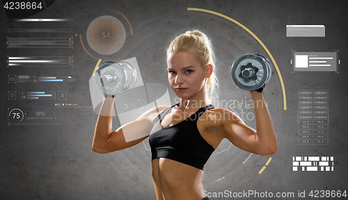 Image of happy young sporty woman exercising with dumbbells