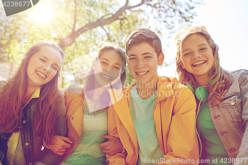 Image of happy teenage students or friends outdoors