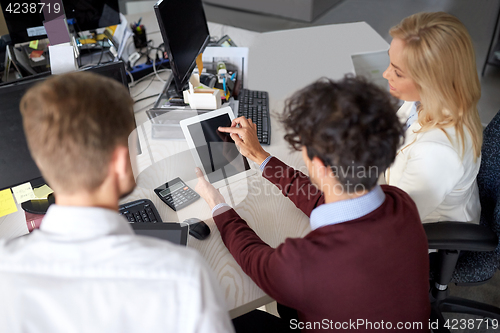 Image of business team with tablet pc at office