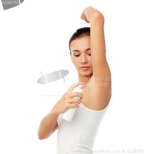 Image of woman with antiperspirant deodorant over white