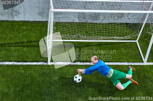 Image of Soccer football goalkeeper making diving save