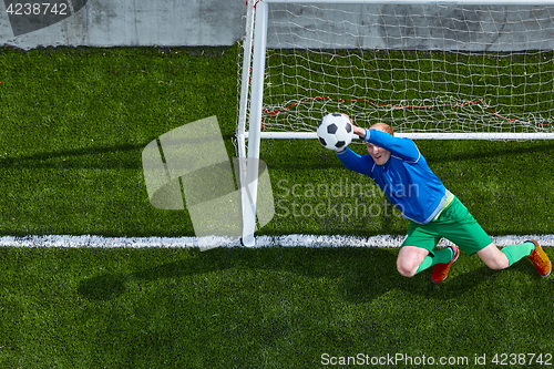 Image of Soccer football goalkeeper making diving save