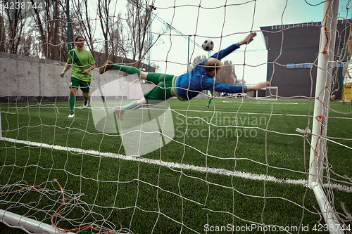 Image of Soccer football goalkeeper making diving save