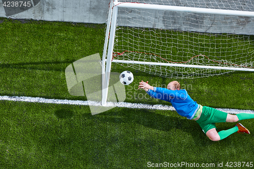 Image of Soccer football goalkeeper making diving save