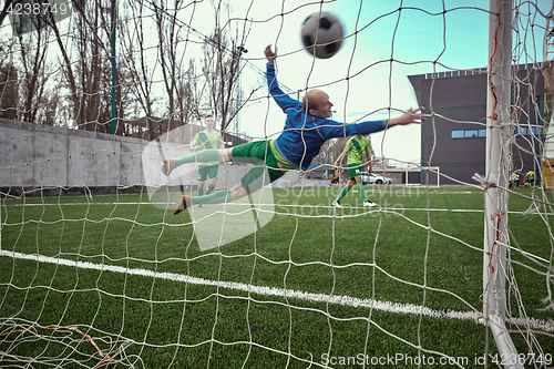 Image of Soccer football goalkeeper making diving save