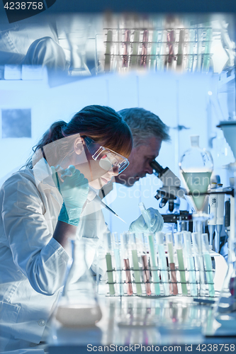 Image of Health care researchers working in scientific laboratory.