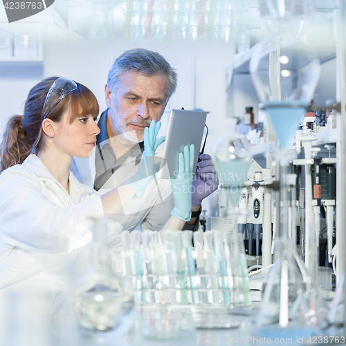 Image of Health care researchers working in scientific laboratory.