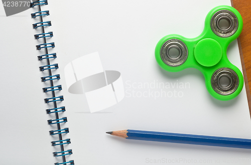 Image of Fidget spinner on notepad