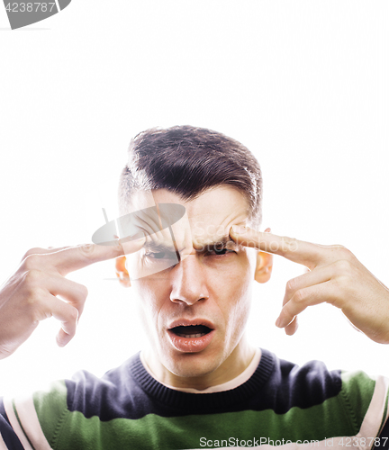 Image of young handsome well-groomed guy posing emotional on white backgr