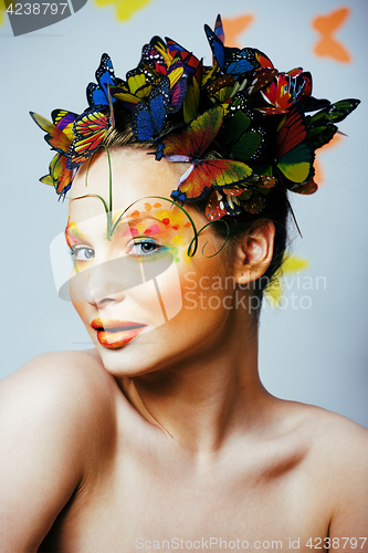 Image of woman with summer creative make up like fairy butterfly closeup 