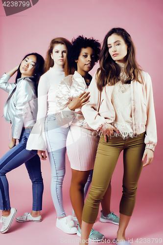 Image of different nation girls with diversuty in skin, hair. Asian, scandinavian, african american cheerful emotional posing on pink background, woman day celebration, lifestyle people concept