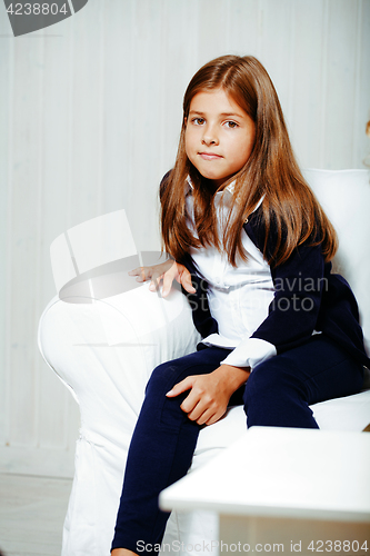 Image of little cute brunette girl at home interior happy smiling close u