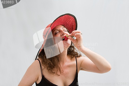 Image of Woman, strawberry and hat