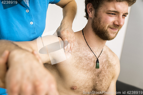 Image of young man at the physio therapy with pain