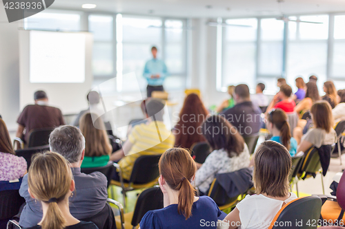 Image of Speaker giving presentation on business conference.