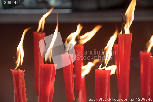 Image of Candles at taoist shrine burning slowly