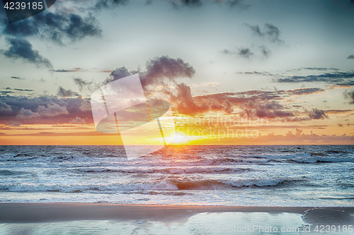 Image of Sunset At The Stormy Sea