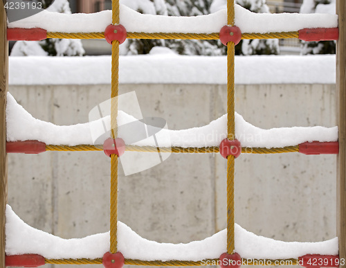 Image of snow on the climb net rope