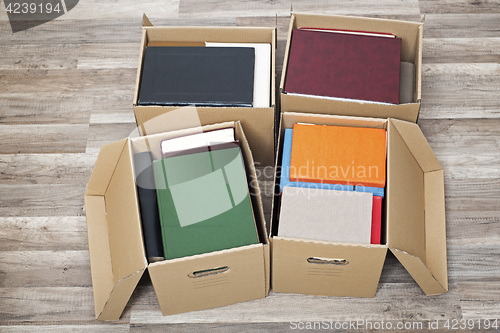 Image of cardboard boxes full of books