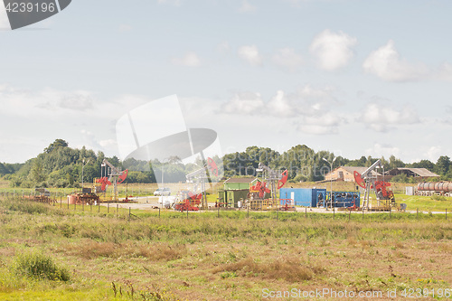 Image of Many working old oil pumps