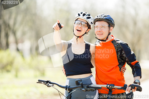 Image of Happy young athletes in helmets