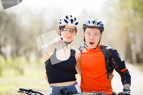 Image of Young cyclists in protective helmets