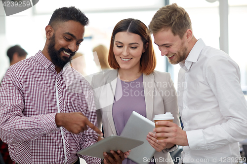 Image of business team with tablet pc and coffee at office