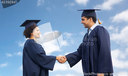 Image of happy students or bachelors greeting each other